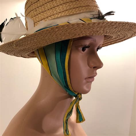 designer hats with attached scarves.